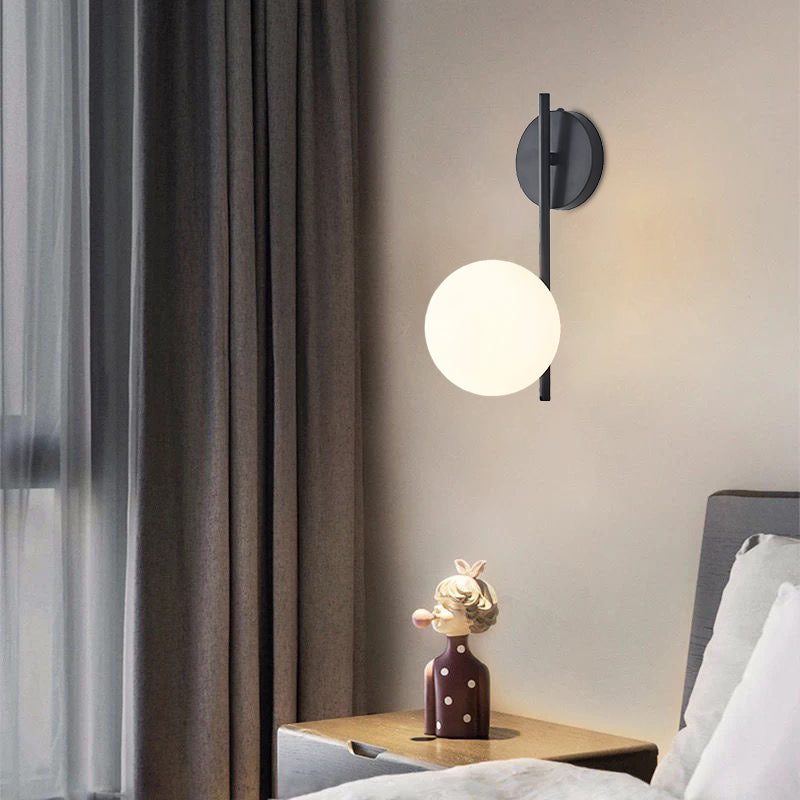 Arbotante Jaspe junto a una cama con cortinas